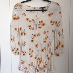White long sleeve romper with yellow sunflowers